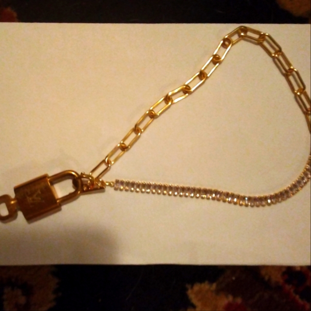 Luis Vuitton Lock with Key Necklace. Unique with Gold & Crystal Chain.